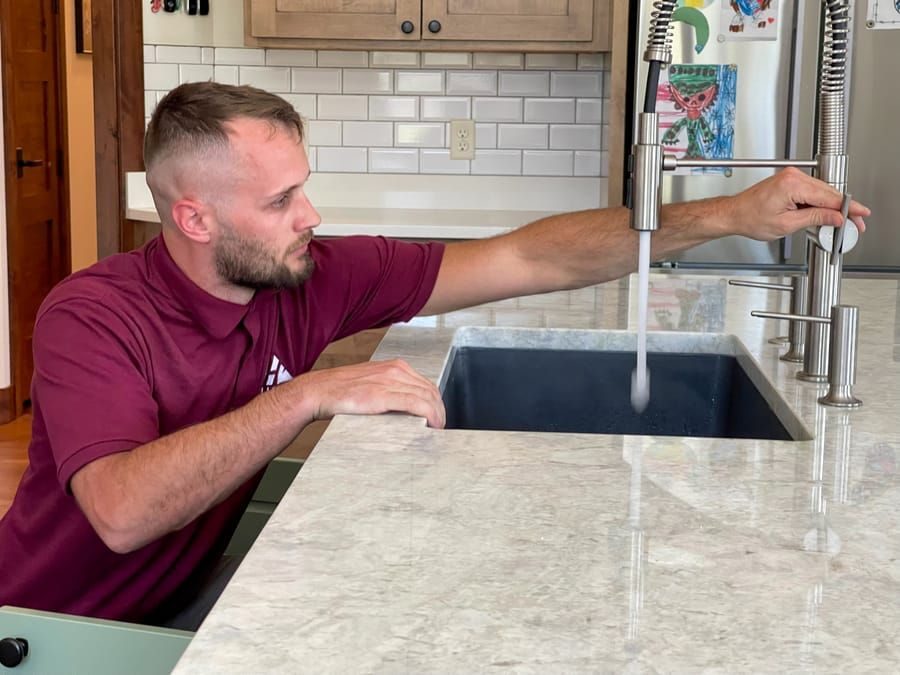 New faucet installation work being done by a plumber